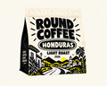 Round Coffee Honduras Light Roast cream bag with black logo and Good Coffee Goes Round side